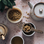 Rustic stone photography surface with plant, tea and honey