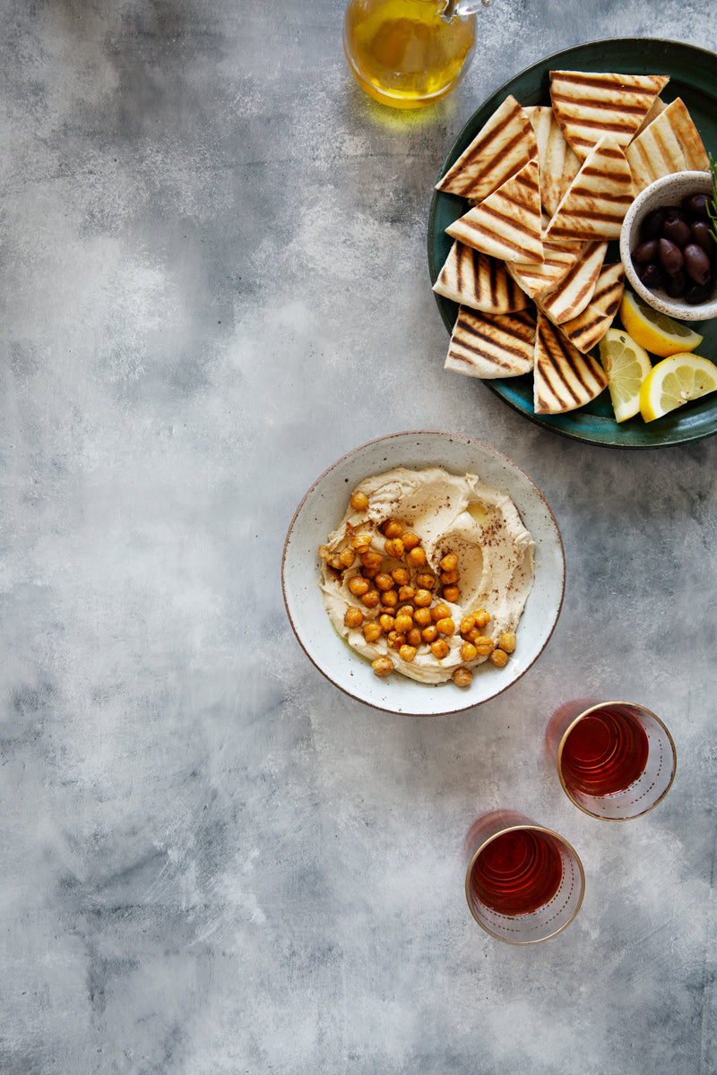 Clay Food Photography Background with hummus and pita
