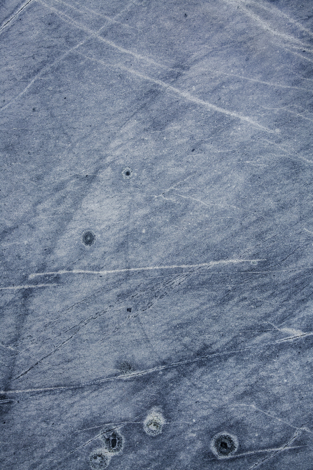 Dark and moody blue stone photography surface