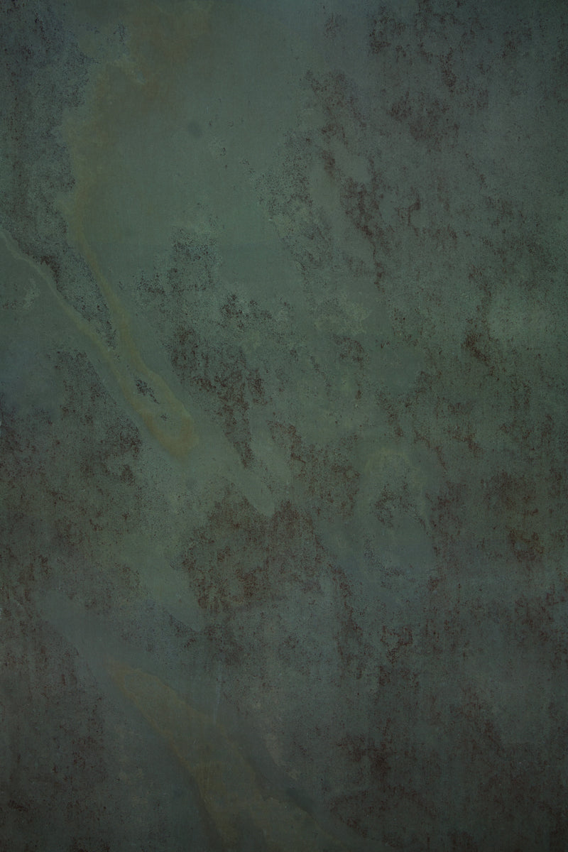 Dark and moody green stone photography surface