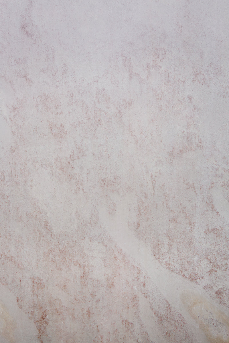 Pale rust colored stone photography surface
