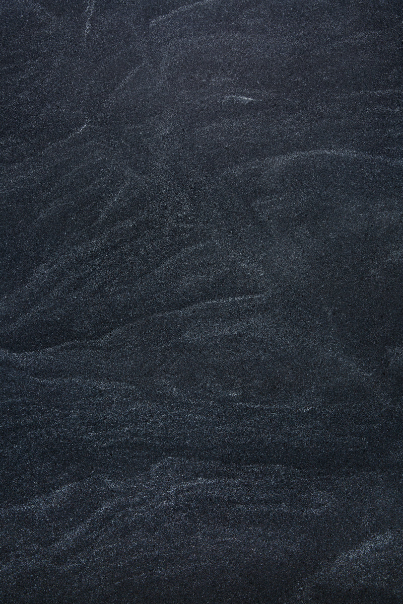 Dark and moody speckled stone photography surface