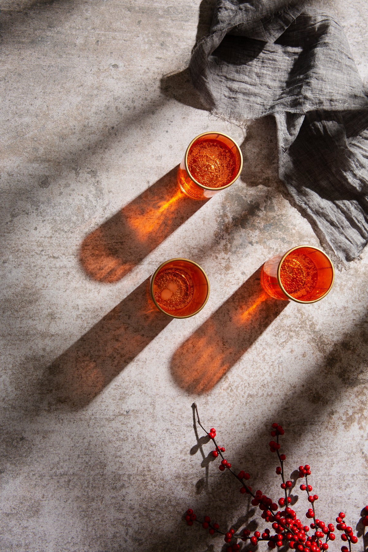 Puck Food Photography Background with orange glasses and decorative red berries
