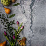 Rustic blue metal photography surface with pears, artichokes and flowers