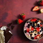 Scarlet Food Photography Background with bowl of yogurt with fruit, nuts and chocolate