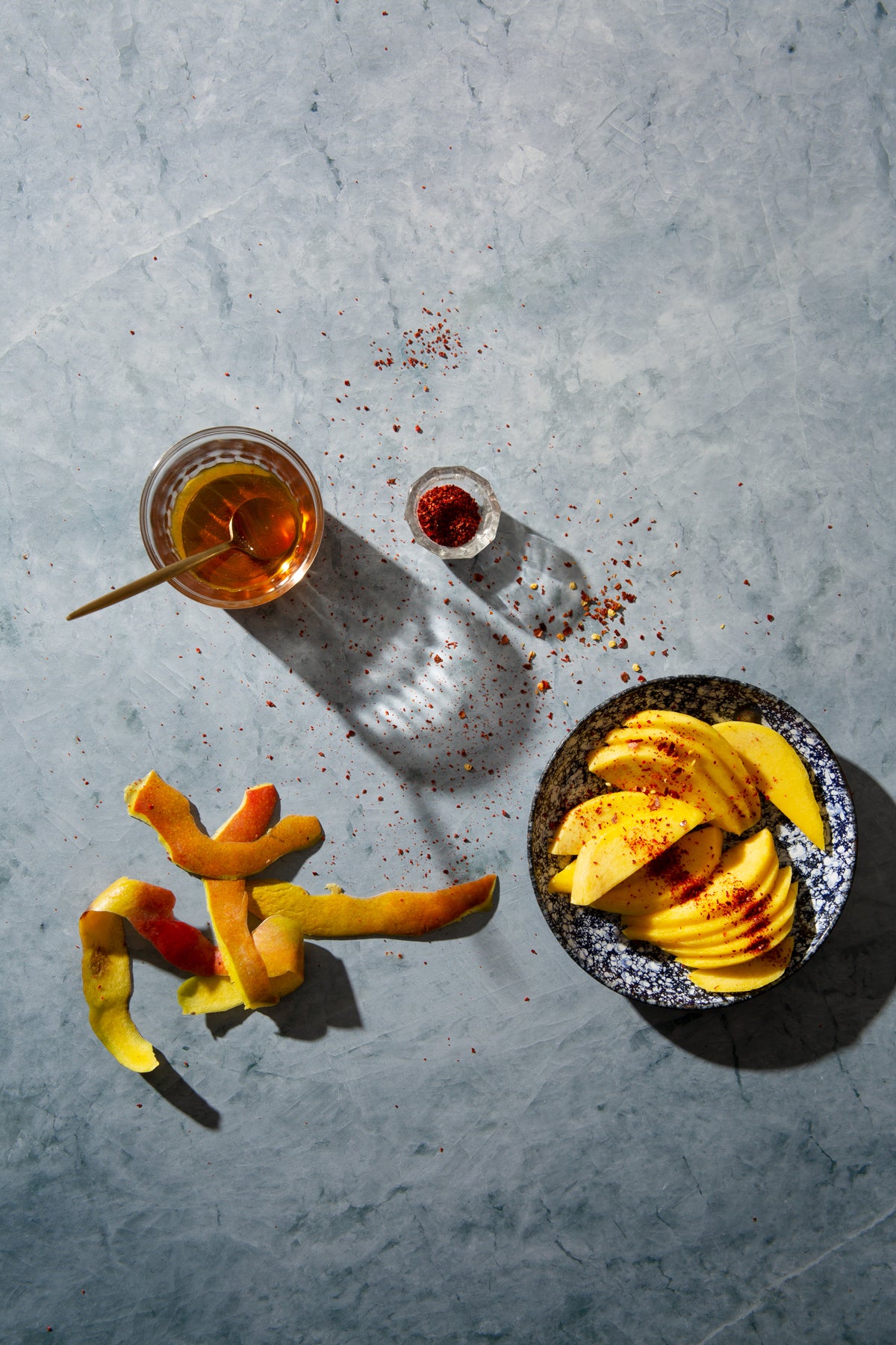 Skye Food Photography Background with sliced mango, honey and chili flakes