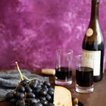 Violet Food Photography Background with cheese, wine and fruit
