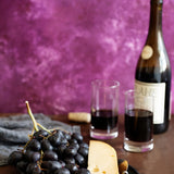Violet Food Photography Background with cheese, wine and fruit