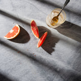 Birch Food Photography Background with slices of grapefruit, a cold drink and dramatic shadows