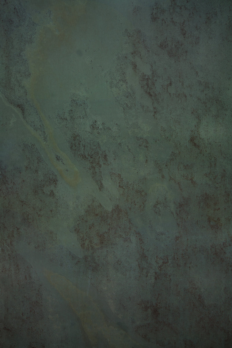 Dark and moody green stone photography surface