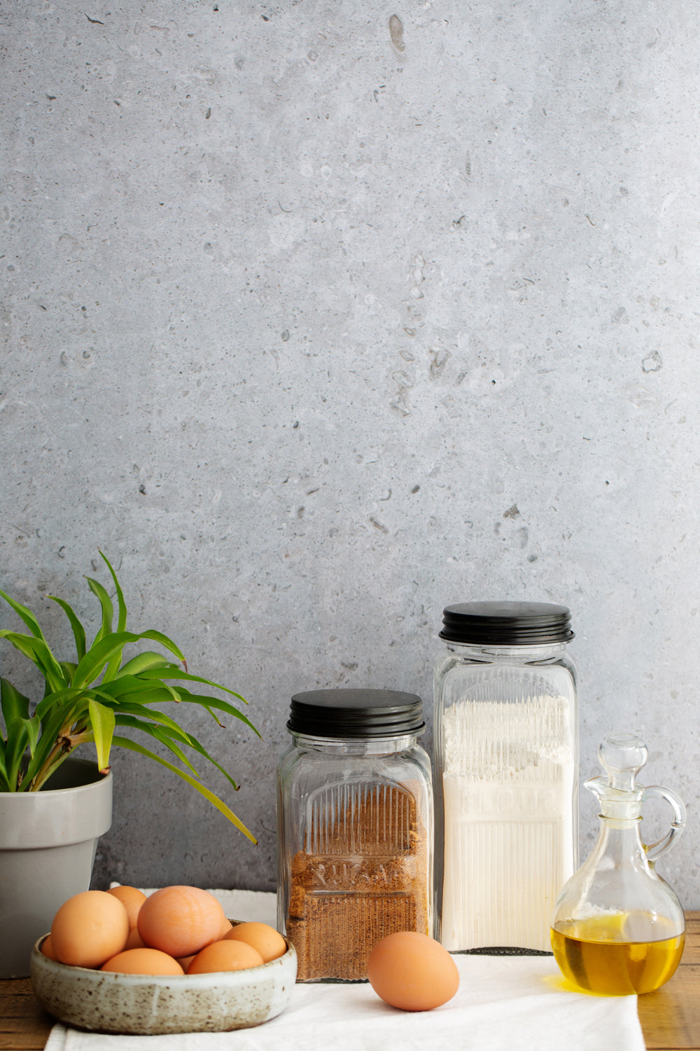 Gray stone photography background with baking ingredients in front
