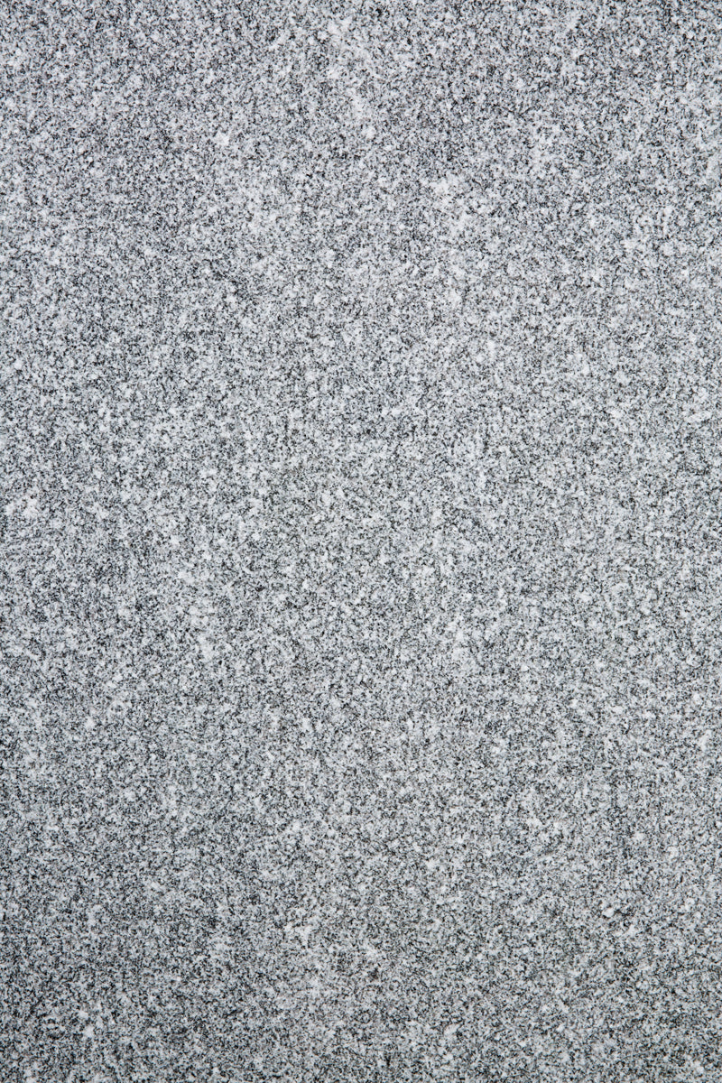 Black & white speckled stone photography surface